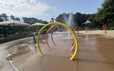 Splash pad with water sprayers and dump buckets at Jack Smith Park in Cary NC